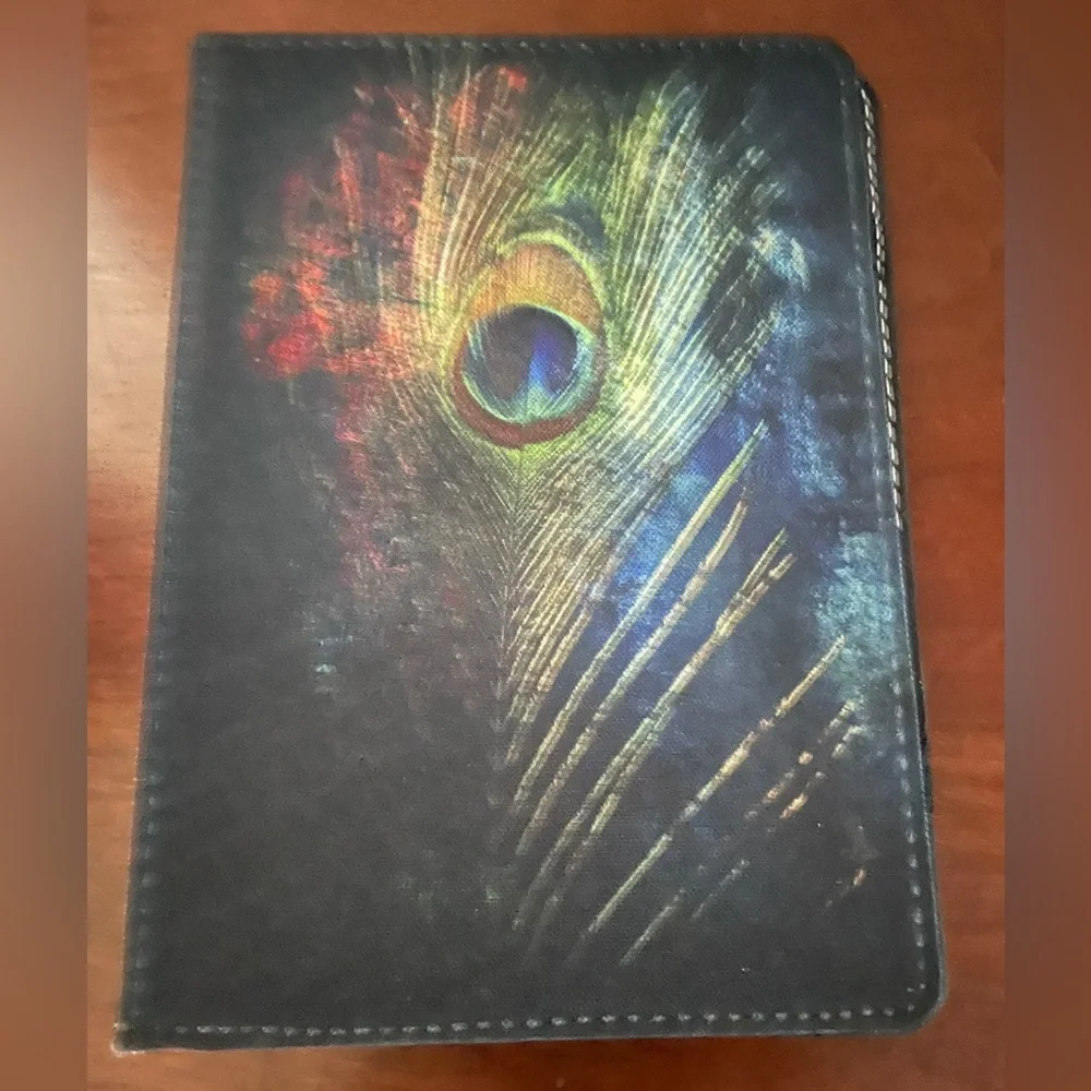 Caseable Tablet case cover 7” with peacock feather motif. Excellent pre used